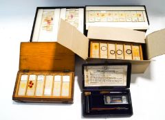 Four cases of microscope slides, some early 20th century, of animal and human specimens,