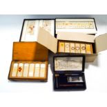 Four cases of microscope slides, some early 20th century, of animal and human specimens,