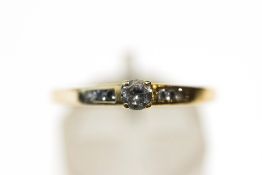 A 9 carat gold ring, stone set dress ring,