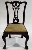 A George III style mahogany dining chair with carved pierced splat,