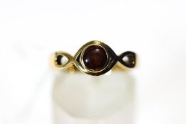 A 9 carat gold single stone garnet ring, finger size M,
