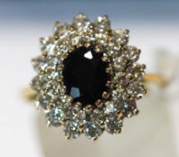 A 9ct gold sapphire and cubic zirconia cluster ring, finger size N,