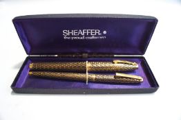 A cased Sheaffer fountain pen and ballpoint pen set;