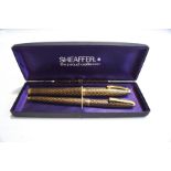 A cased Sheaffer fountain pen and ballpoint pen set;