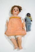 A large 1920's/1930's Armand Marseille doll with bisque head, impressed marks to neck, 65cm tall,