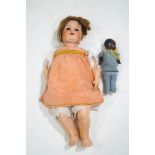 A large 1920's/1930's Armand Marseille doll with bisque head, impressed marks to neck, 65cm tall,