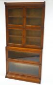 An oak Globe Wernick style four section glazed bookcase,