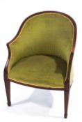 An Edwardian mahogany tub shaped chair with green upholstery
