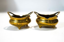 A pair of Chinese miniature two handled bronze censors,