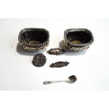 A pair of late Victorian silver salts; with a silver salt spoon; and three silver brooches,