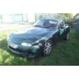 A 1990 Mazda MX-5, registration number H679 ECK, green. Imported in 2001, this Mk.