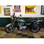 A 1980 Kawasaki Z900, registration number GHT 108W, green.