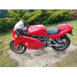 A 1997 Ducati Supersport 600 Desmo, registration number R536 KFW, red.