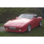 A 1988 TVR 350i Convertible, registration F115 SCK, chassis number SA9DH35PXHB019123, red.