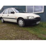 A 1996 Ford Escort L 5-Door Saloon, registration number N987 XLS, white.