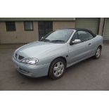 A 2000 Renault Megan 1600 Sport Convertible, registration number W691 SPW, silver.