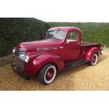 A 1942 Chevrolet AK Series Pick Up Custom, registration 501 YUX, chassis number BD39653, red.