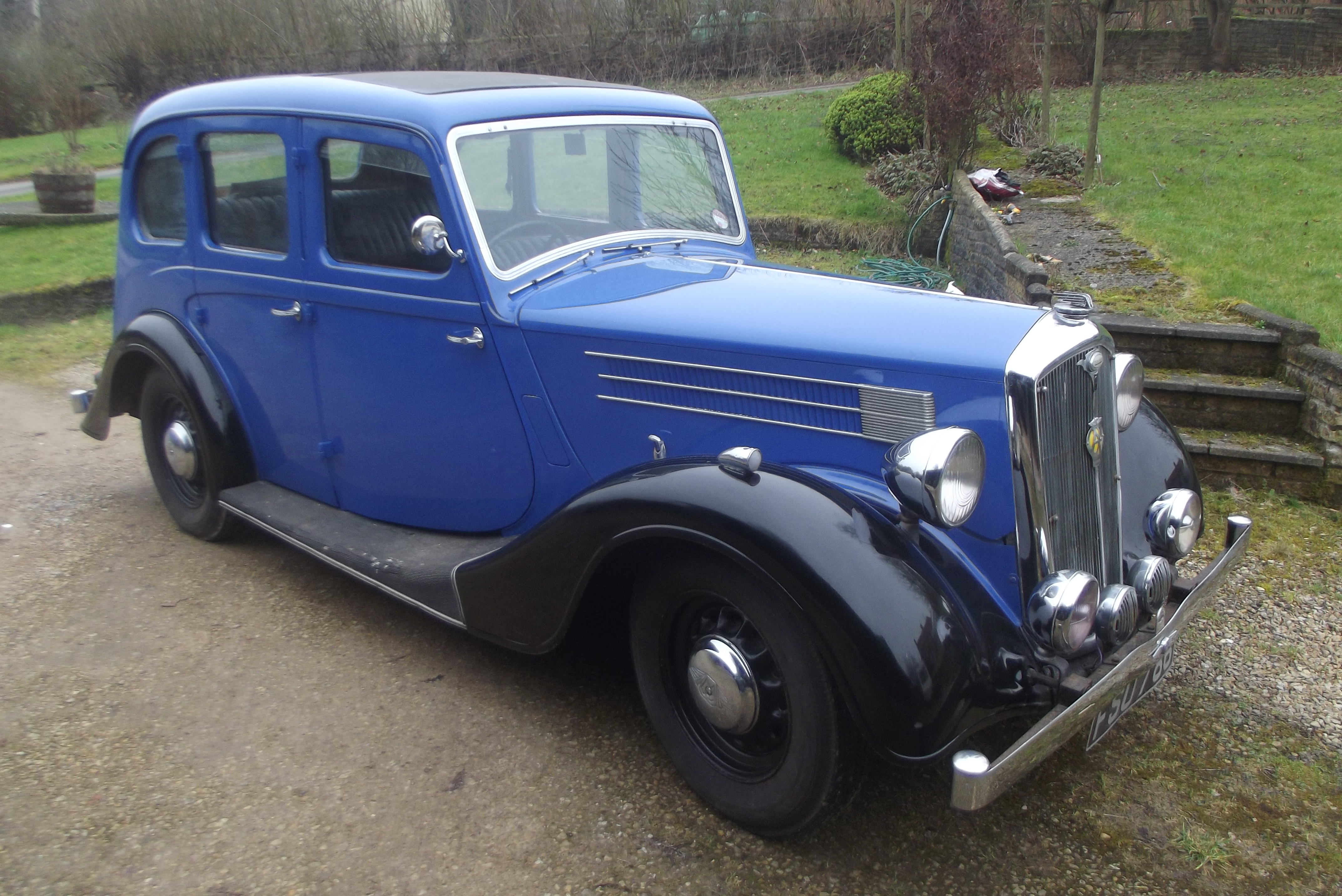 A 1939 Wolseley 14/60, registration FSU 786, blue over black.