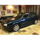 A 2002 VW Golf 4Motion 2.8, registration number OE52 UNY, blue.