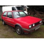 A 1991 VW Golf Driver, registration number J535 CCL, red.