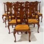 A set of ten American cherrywood dining chairs with rush seats