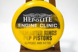 A printed metal Hepolite Engine Clinc advertising sign,