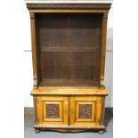 An Edwardian oak open bookcase, carved Classical detail to the cornice, reeding and mouldings,