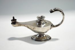 A loaded silver table lighter in the form of a Middle Eastern lamp, 15 cm long,