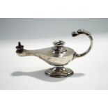 A loaded silver table lighter in the form of a Middle Eastern lamp, 15 cm long,