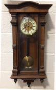 A mahogany cased eight day regulator clock, with painted flower decoration to the front panels,