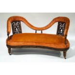 A Victorian Anglo Indian rosewood show frame double back settee, with elaborately carved apron,