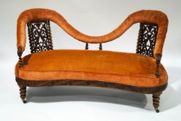 A Victorian Anglo Indian rosewood show frame double back settee, with elaborately carved apron,