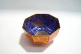 A Wedgwood octagonal orange and blue lustre bowl, with gilt exotic decoration,