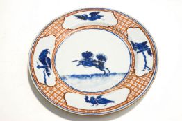 A 19th century Chinese plate, decorated with panels of birds surrounding a dog within the centre,