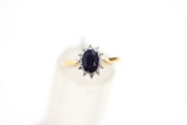 A sapphire and diamond 9 carat gold cluster ring, finger size K1/2, 1.