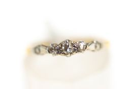 A three stone diamond 18 carat gold ring, finger size K, 1.