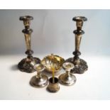 A pair of electroplated desk candlesticks; a pair of Sheffield Plate candlesticks;