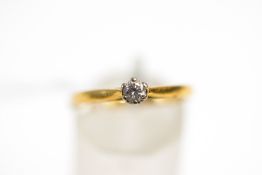 A single stone diamond 18 carat gold ring, the brilliant cut of approximately 0.