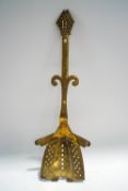 An unusual brass chestnut roaster, in the form of a Bishop,
