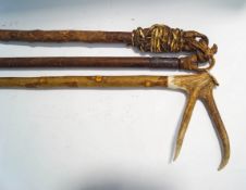 A threshing stick and a horn handled walking stick,