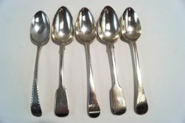 A bright cut Georgian silver table spoon; a pair of Victorian silver fiddle pattern table spoons;