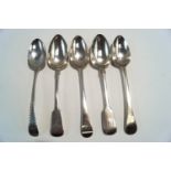 A bright cut Georgian silver table spoon; a pair of Victorian silver fiddle pattern table spoons;