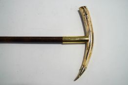 A bamboo shafted walking stick with Ibex horn handle and brass mounts