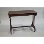 A Victorian rosewood centre table with barley twist supports,