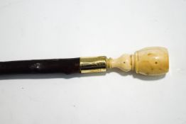 A hawthorne shafted walking cane with ivory knop