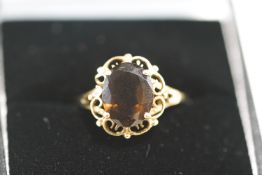 A 9 carat gold smoky quartz ring, finger size N, 1.