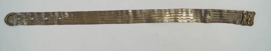 A Turkish silver gilt belt and buckle, with stamped marks, 89 cm long,