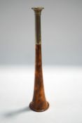 A copper and nickel hunting horn stamped Swaine and Adeney, London, Proprietors of Kohler & Sons,