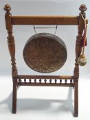 An Edwardian oak framed dinner gong, 89cm high, 56.