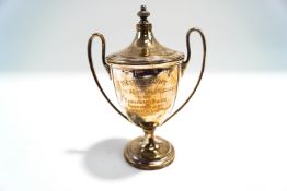 A silver two handled trophy cup and cover, by Walker & Hall, Sheffield 1933,